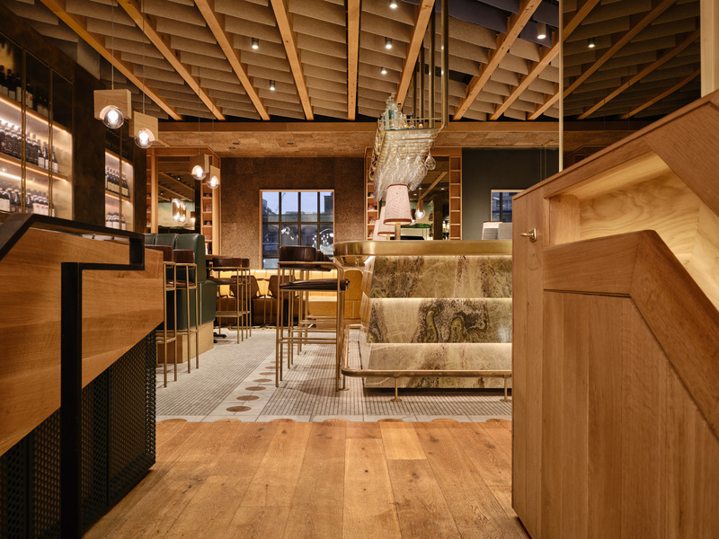 The second-floor bistro lines the historic building with new layers of cork, wood, mirrored glass, and stone, treated with a greater degree of refinement than the market level.
Photo credit: Doublespace