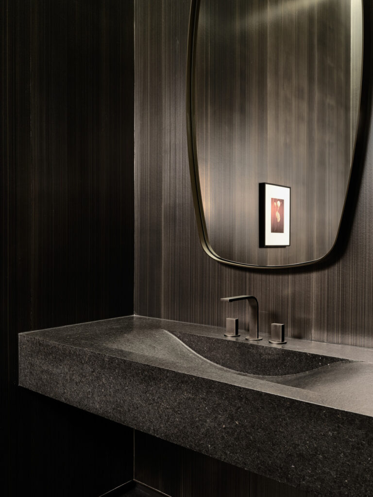 Powder room with custom stone carved vanity by BURDIFILEK.
Photo credit: Doublespace