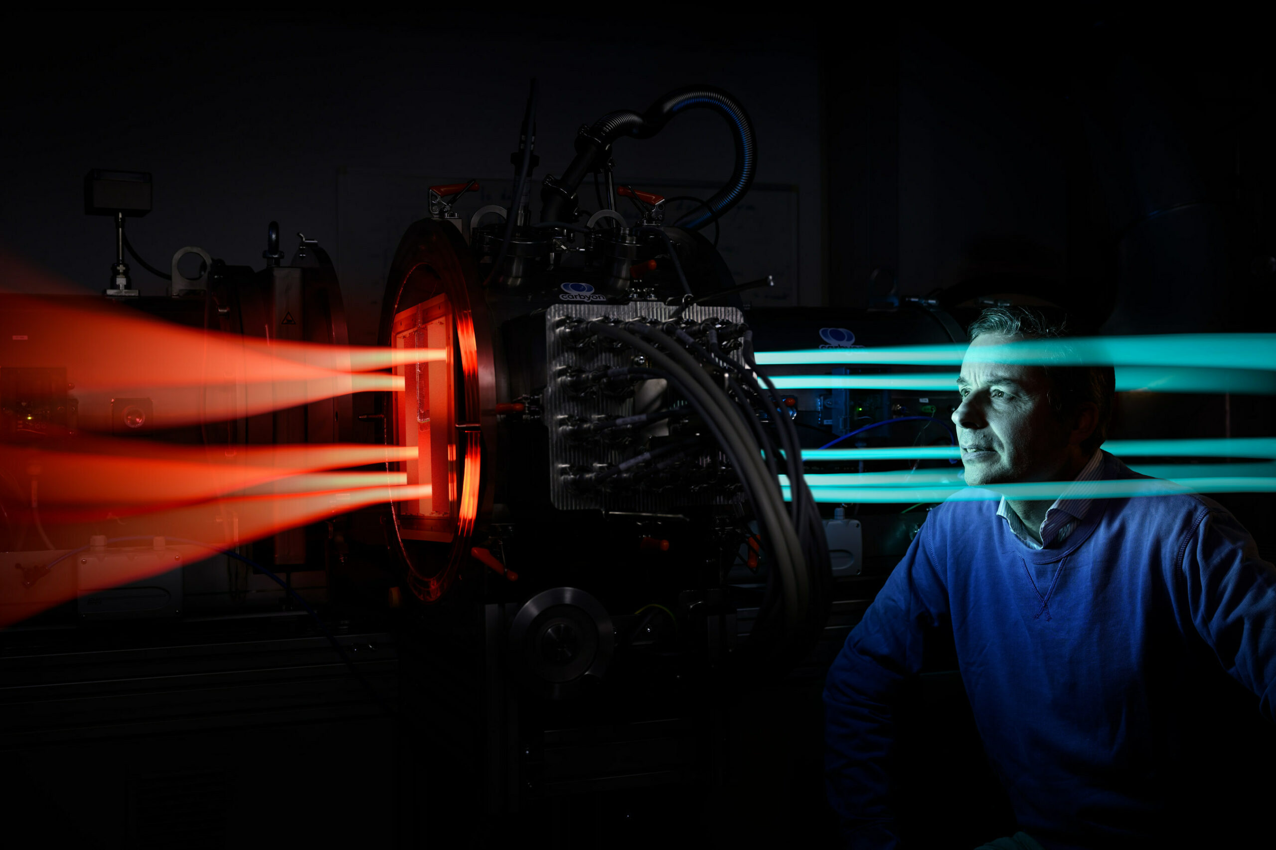 Hans De Neve (CEO and founder) looking into Carbyon’s CO2 capturing prototype: “Our relentless stare-down with Mother Nature’s laws of physics finally gave us the insights into how to solve the puzzle.” Carbyon is the first Direct Air Capture company to merge low CAPEX with low energy demand, thanks to their unique fast-swing process. Photo by Bart van Overbeeke Photography