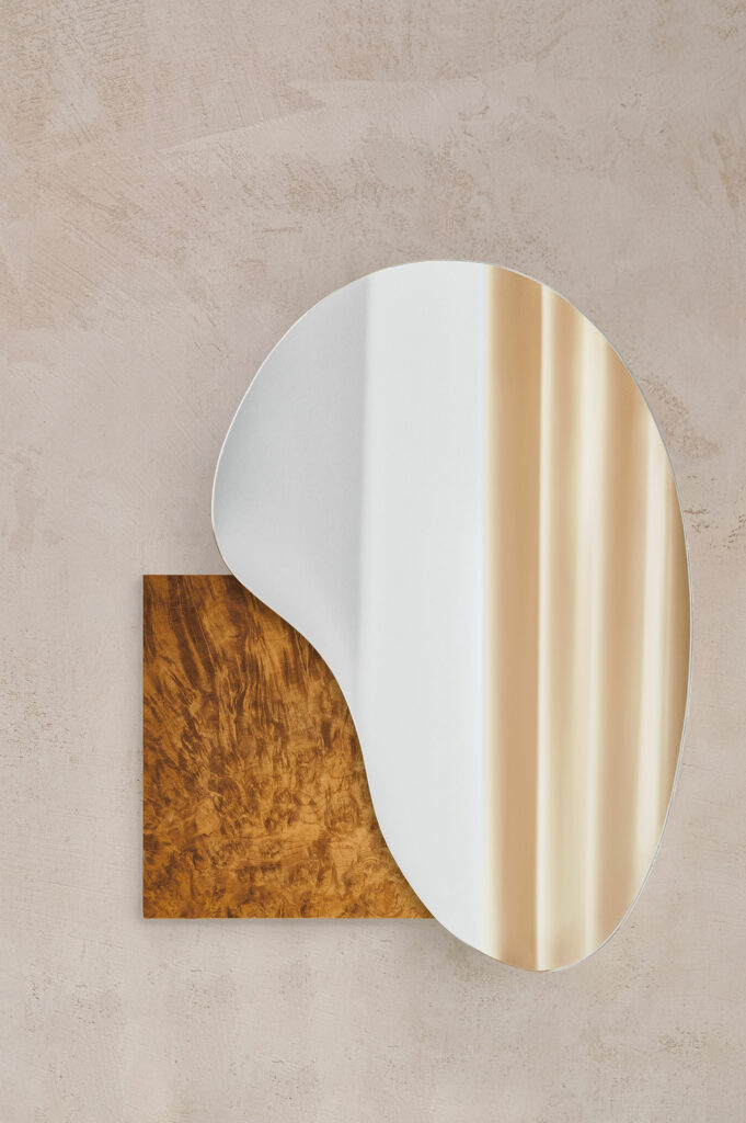 The Multifaceted Versatility of Wood, Brass, Oxidized Copper, Marble, and Onyx in Mirror Design