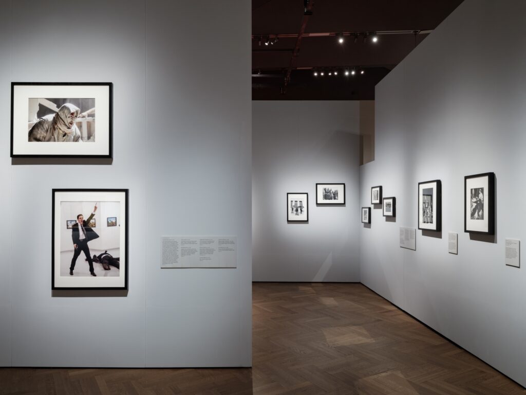 10 - The exhibition walls often feature cut-outs to allow glimpses between sections