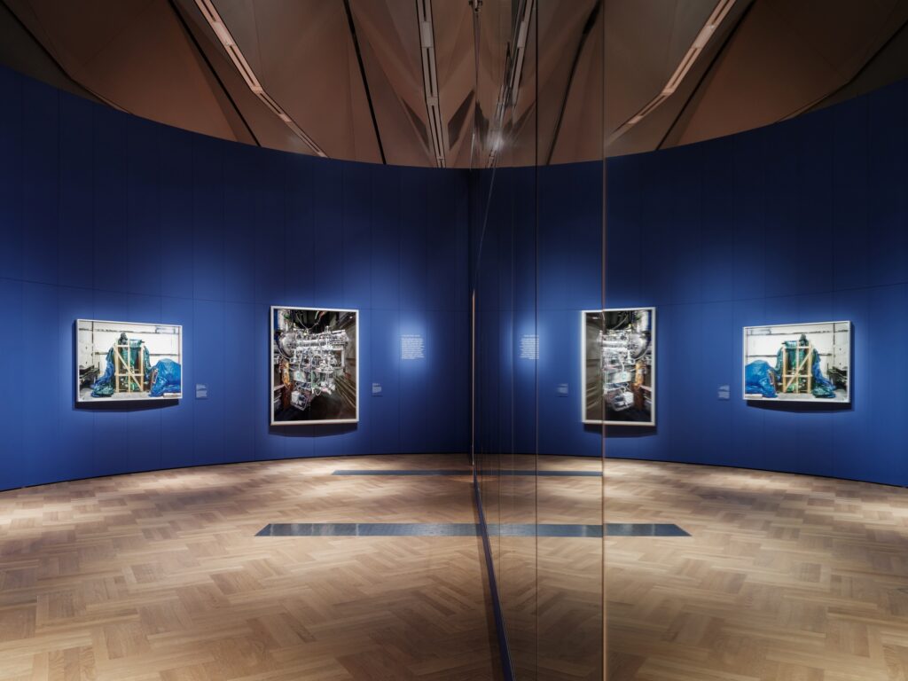 The final section includes a mirrored wall for visitors to see themselves, playing with ideas of observer and observed