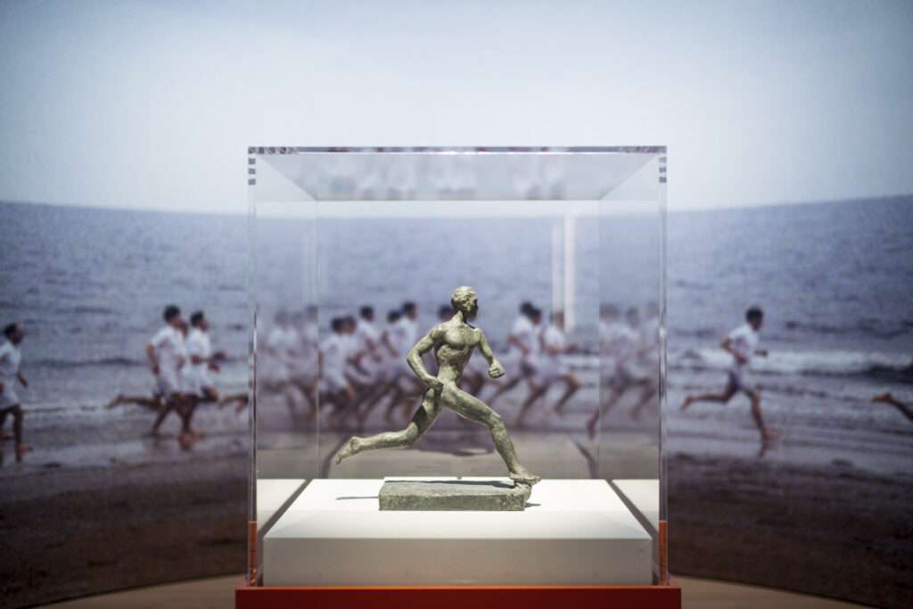 Close-up of the running-man sculpture