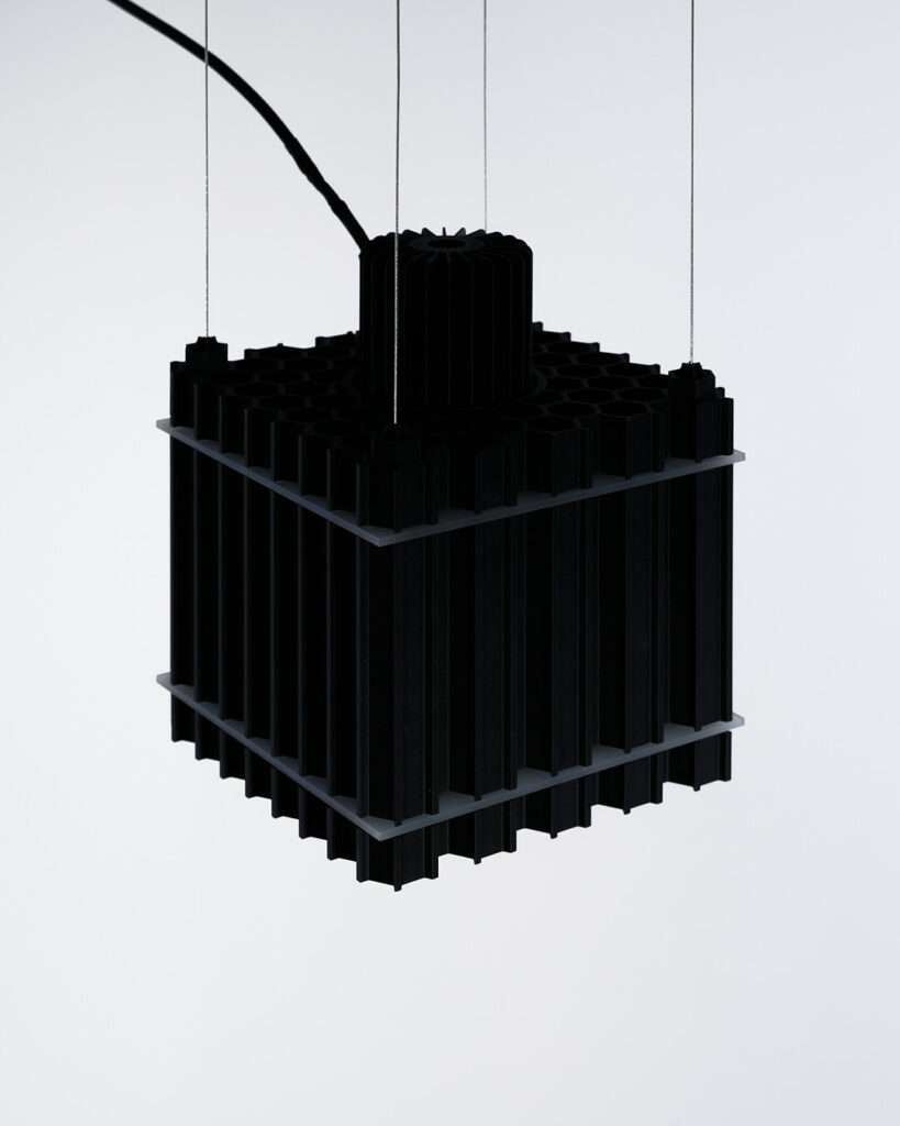 The fusion of art, design, and light takes on a bold form in Grid Extrusion, a collaboration between two visionary artists, Juliana Campos and Aster Verrier. Inspired by the complexities of machinery and the directional qualities of light, this striking piece embraces a raw, industrial aesthetic that turns functionality into a work of art.