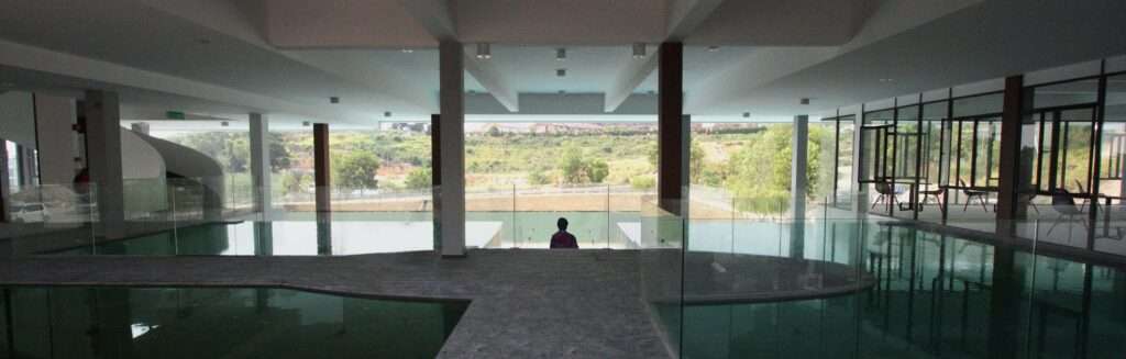 The Concrete Cloud - The water lobby. Water that cascades down from one water element to another water element at various floors together with the lake further cools down the breeze that penetrates building