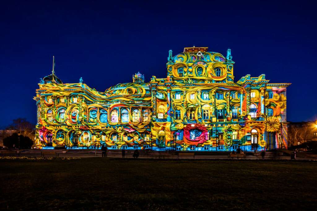 Colopera / Croatian National Theatre Trg Republike Hrvatske 15 Author: FOL International Daniel Margraf – Spreefunkeln / GERMANY Step onto a journey through this surreal world of colours and light! The historical façade of Croatian National Theatre will come to life through colourful patterns and light images, evoking the emotions of love, happiness and hope.