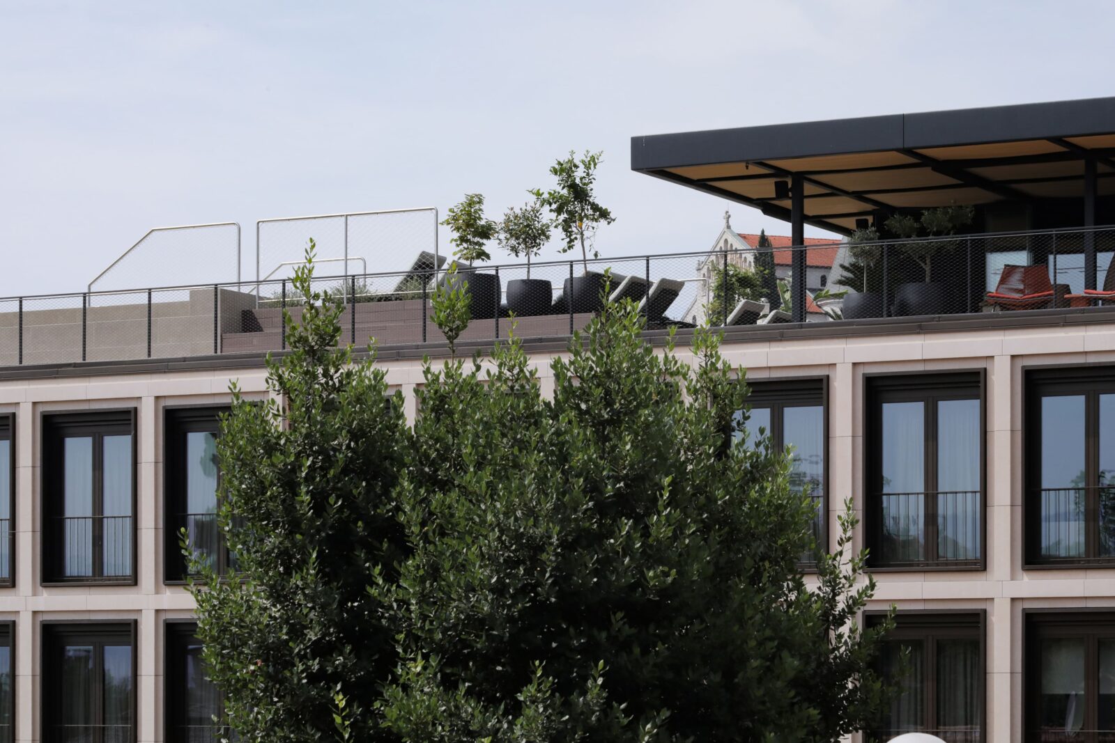 The rooftop sun deck with bar and infinity pool represents an escape into a dreamy world