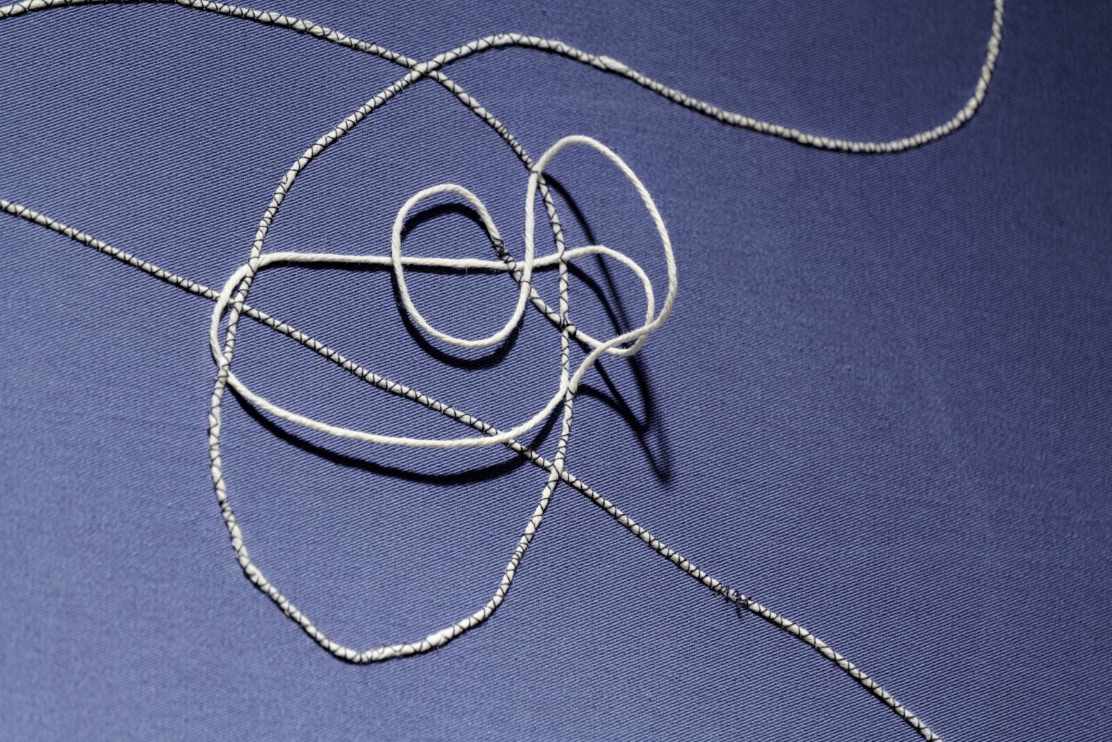 The sewn elements in this space become more chaotic to reflect the more difficult subject matter in Room Two