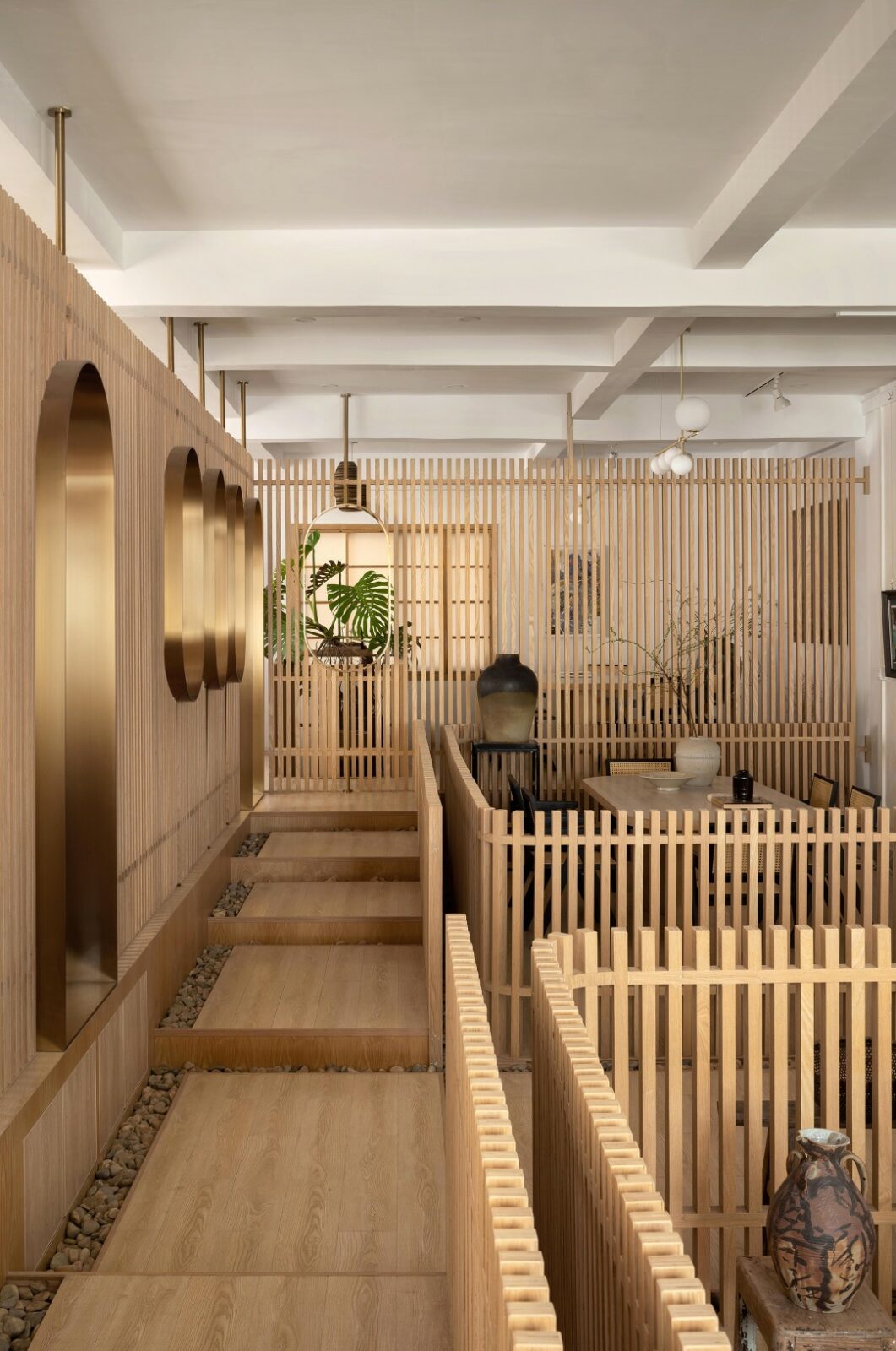 Lim + Lu's An Artist's Teahouse is a calm, beautifully layered hideaway where creativity and tradition sip tea together. Set in a sleepy little village in Foshan, the 200-square-meter space feels like the artist's own quiet rebellion against noise, equal parts thoughtful design and personal sanctuary.