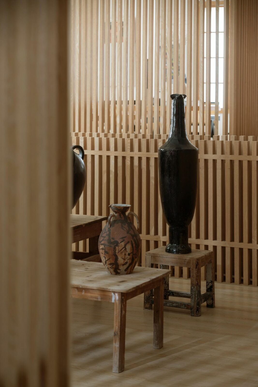 Lim + Lu's An Artist's Teahouse is a calm, beautifully layered hideaway where creativity and tradition sip tea together. Set in a sleepy little village in Foshan, the 200-square-meter space feels like the artist's own quiet rebellion against noise, equal parts thoughtful design and personal sanctuary.