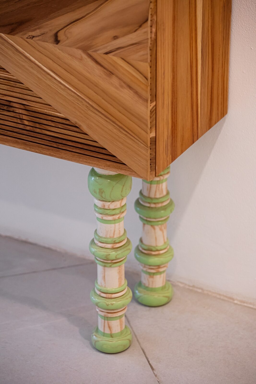 Two versions of the console differ in legs design.