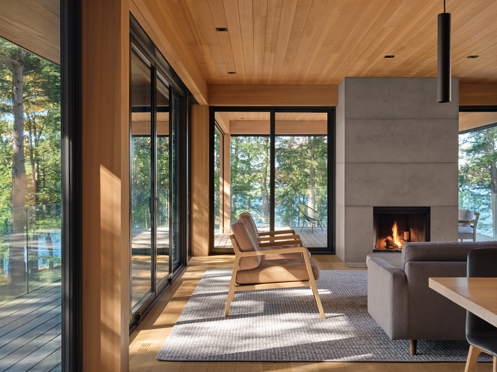 A cast concrete hearth forms the focal point of the space, surrounded by ample seating
designed to invite gathering and connection