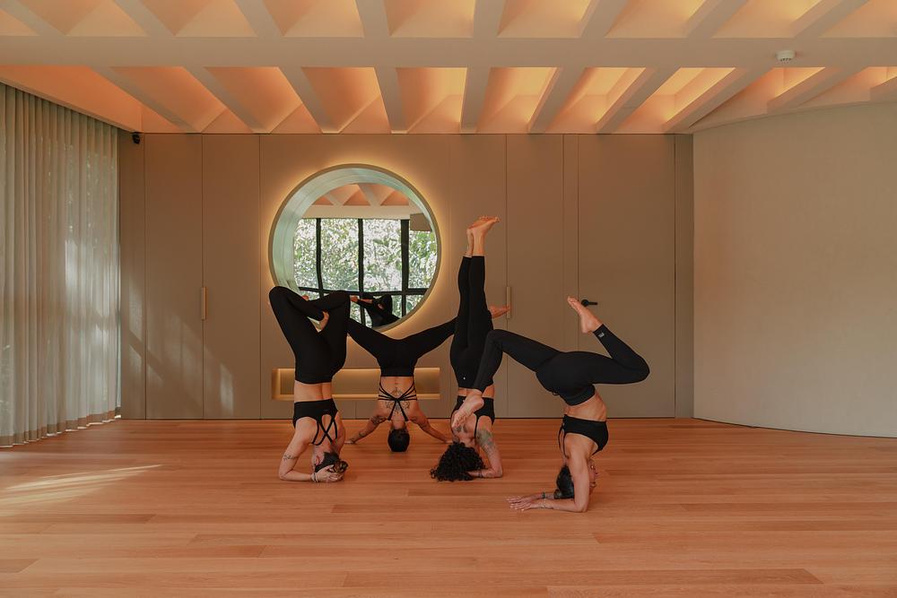 The lighting design supports a variety of yoga practices