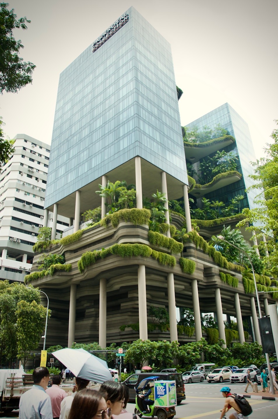 A group of people standing in front of a tall building