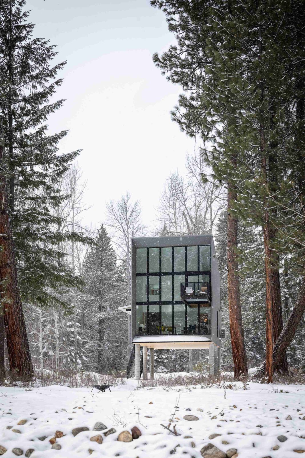 Wenatchee River Cabin by Wittman Estes. View os the façade in the snow.