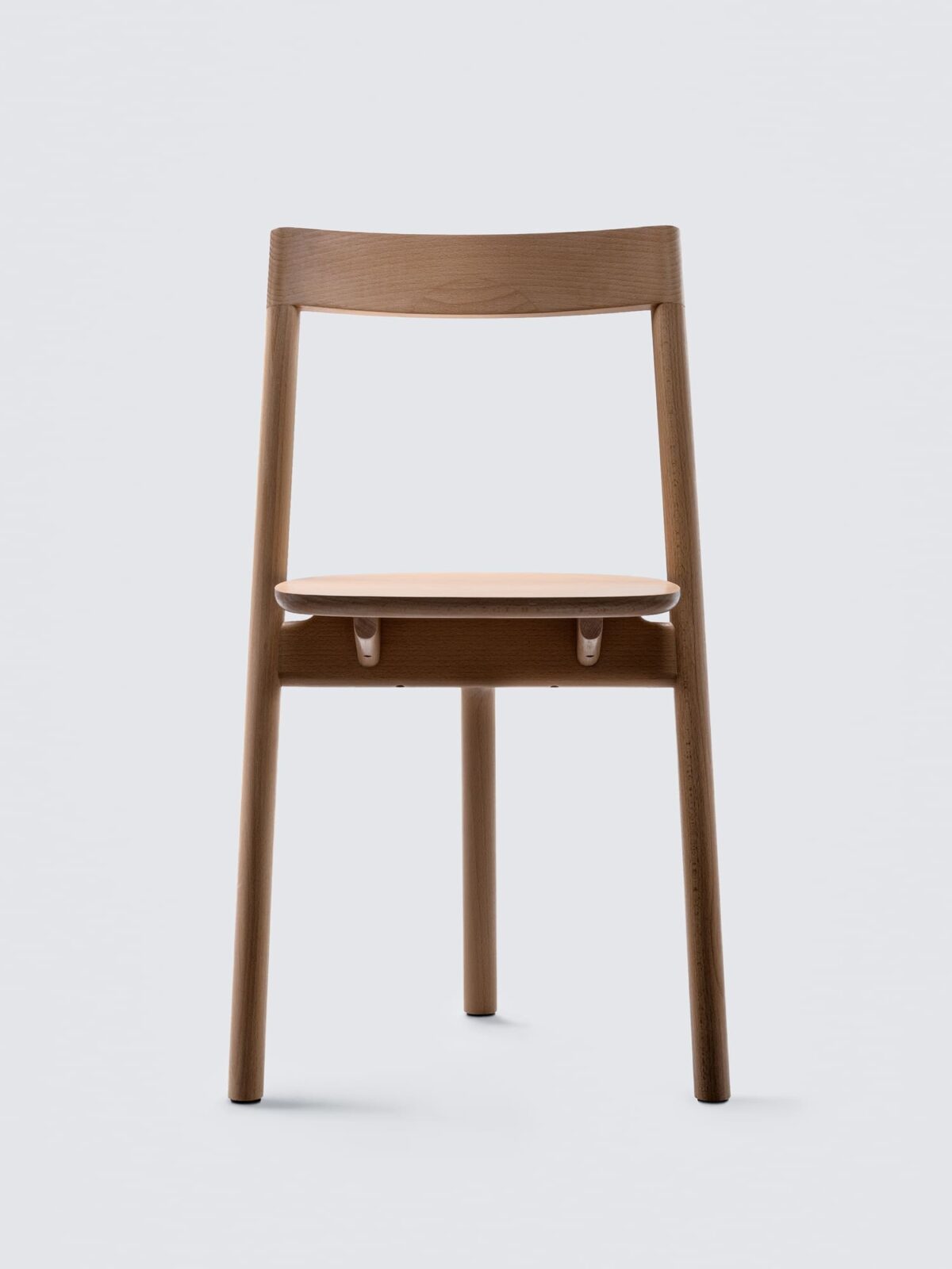 Mezza Chair: Three-legged dining chair by Ignacio Merino , Italy