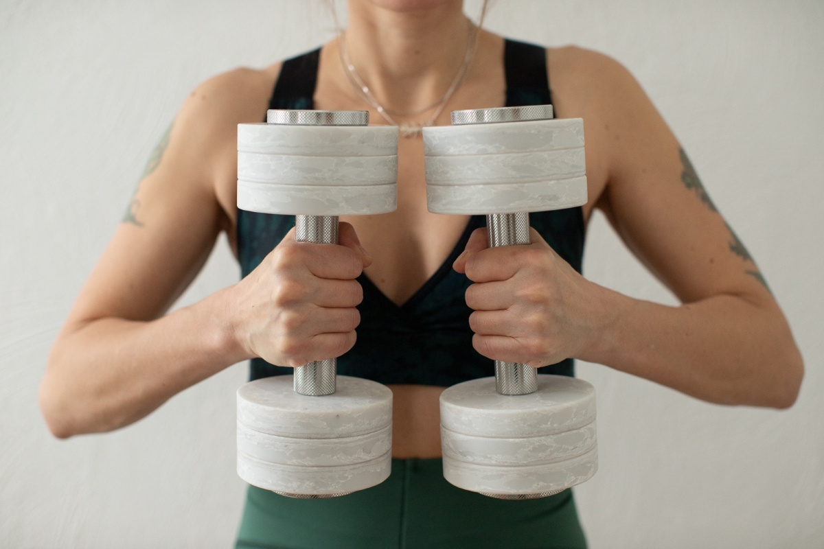 Model holding two frozen gym chic