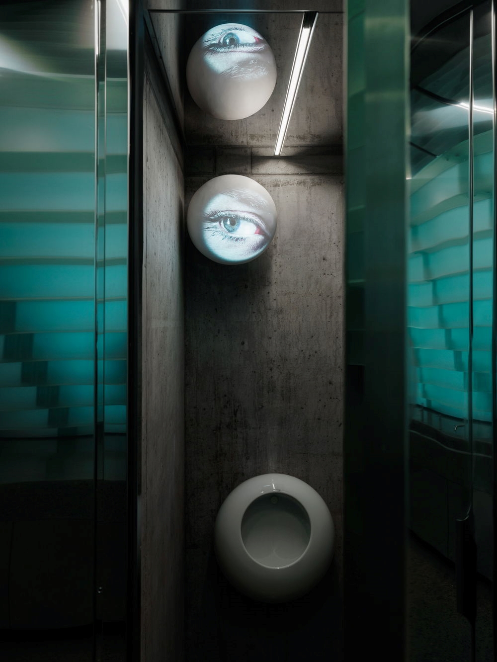 Toilet art by Tony Oursler.