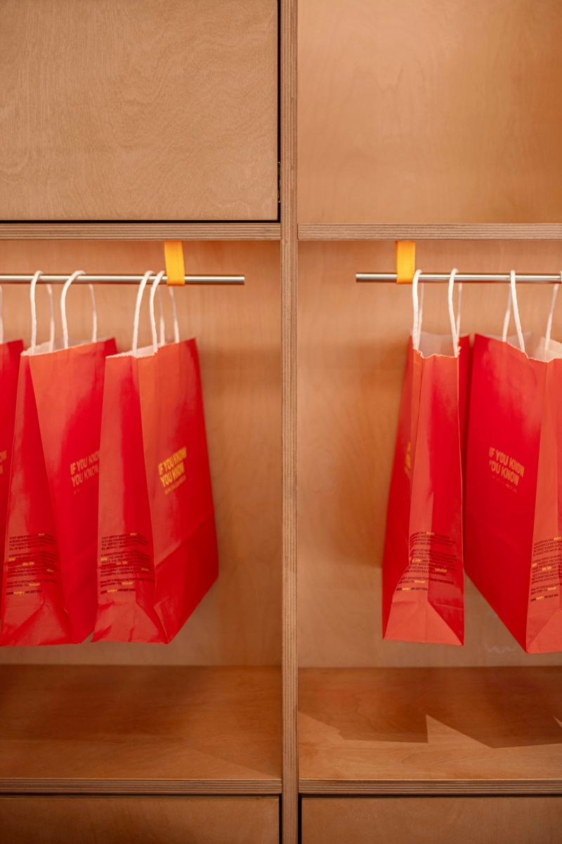 IYKYK custom merchandise cabinet